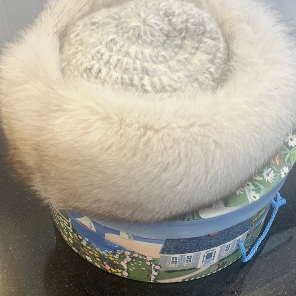 Beautiful classy grey and silver real fur hat. In perfect condition.